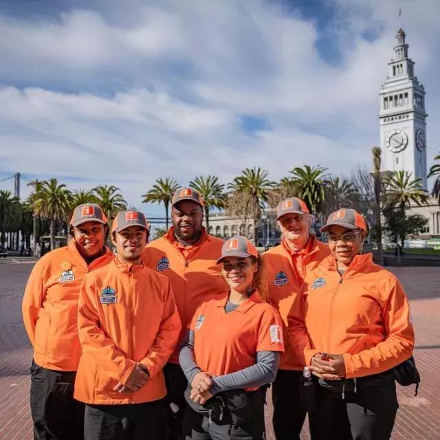 San Francisco's Welcome Ambassadors prepare to greet 访问ors at the Ferry Building.
